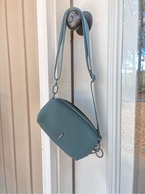 Thacker adjustable strap pouch purse. Dark green.